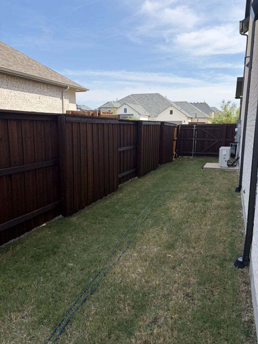 Side yard fence and gate in a deep brown stain